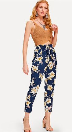 These sassy but sweet floral pants are adorable yet chic. Featuring ruffled, elastic waist and a tapered fit falling just above the ankle. Did we mention front pocket... yes FRONT POCKETS! These pants pair perfectly with a bodysuit suit, cropped top or sweater so be sure and check out our other collections. Complete your look with wedges, heels ors sandals. Made with a polyester blend for comfort and style. Floral Belt, Wedges Heels, Mode Boho, Belted Pants, Pants Large, Straight Trousers, Sweet Floral, Floral Pants, Tapered Pants