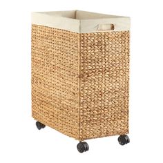 a wicker laundry basket with wheels on white background