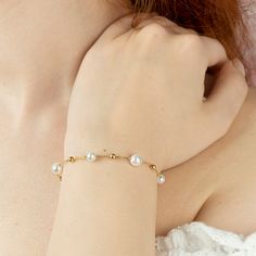 💎 Experience pearl elegance every day with the Dainty Pearl bracelet. 💎 It is produced by hand in 14k gold or 925 sterling silver according to your request.  💎 Also a great choice as a gift. We are preparing it as a gift package for you. 💎Our bracelet is made with crystal pearls and real gold or real silver chains and balls according to your request.  💎 It is completely handcrafted. Bridesmaid Bracelet, Daughter gift. Promoted Gift.  💎 You can make sets with our other pearl jewellery. 💎 P Elegant Hypoallergenic Rosary Bracelet, Elegant Hypoallergenic Round Rosary Bracelet, Elegant Gold Hypoallergenic Rosary Bracelet, Elegant Hypoallergenic Gold Rosary Bracelet, Elegant Jubilee Rosary Bracelet Bangle, Elegant Hypoallergenic Gold Bracelet, Elegant Hypoallergenic Charm Bracelet, Elegant Everyday Rosary Bracelet, Elegant Hypoallergenic Gold Bangle Bracelet