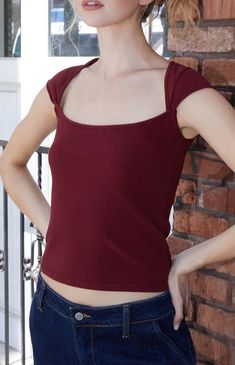 The Burgundy Ella Top from John Galt keeps you cool and casual this season with its short cap sleeves, scoop neckline, and regular fit.


	Solid color top
	Short cap sleeves
	Scoop neckline
	Good stretch
	Regular fit
	96% cotton, 4% elastane
	Machine washable
	One size fits most
	Model measurements: 5’8.5” height, 32” bust, 24” waist, 34” hips Cute Modest Tops, Red Top Aesthetic, Birthday Outfit Casual, Dark Red Top, 2025 Aesthetic, Balconette Top, Tøp Aesthetic, Modest Tops, Burgundy Top