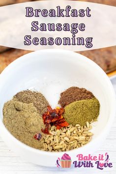 a white bowl filled with different types of seasoning in front of some breads