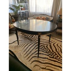 a zebra print rug in front of a table