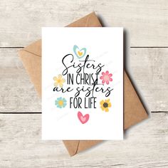 a card with the words sisters in christ are sisters for life on it and flowers