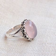 Gemstone - rose quartzGemstone Size - 10x14  oval Metal - Sterling SilverNatural rose quartz sterling silver ringTo change the ring size i request the buyer to pull the band lock in the opposite direction. The ring can be customized on request and gemstone can be switched to any gemstone you want. Feel free to contact me for any queries regarding jewelryfor bulk order please contact me through messages. The ring will be a gift wrapped in a premium handmade jewelry box. Valentine Gift Idea, Office Jewelry, Plus Size Rings, Handmade Jewelry Box, Onyx Jewelry, Rose Quartz Ring, Rose Quartz Gemstone, Matching Jewelry, Handmade Rings