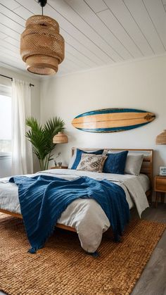 a bedroom with a surfboard hanging above the bed