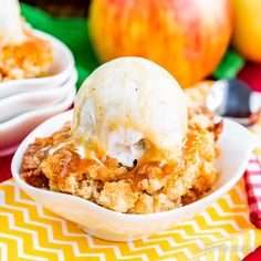 an apple cobbler with ice cream on top in a bowl next to other desserts