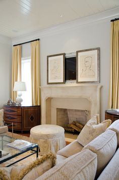 a living room filled with furniture and a fire place