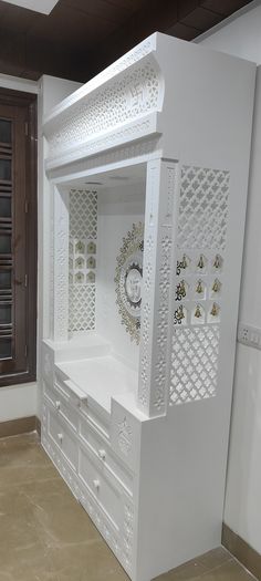 a white cabinet with a clock on it