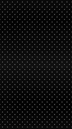 a black background with white polka dots