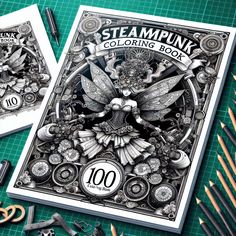 two steampunk coloring books with scissors and pencils