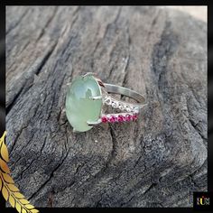 "Prehnite is a captivating gemstone with a soothing green color. Revered for its calming energy and ethereal glow, it promotes harmony and personal growth. Adorn yourself with nature's serene embrace. * Gemstone: Prehnite & Cubic Zirconia * Gem color: Green, White & Pink * Size: 10x14 mm * Weight: 5.45 ct. * Metal Purity: 925 Sterling Silver  * Usage: For Girls & women Jewels as Unique as You Are 💎💖 Keep Noted- All the products' photographs are taken under natural light or a flashlight. However, the color you see in the picture may be a little different compared with the real product. We always try our best to capture the photos so that you can get a clear view of the product ♥ If you require any other assistance, I would be more than happy to help you. ♥ If You Like Our Product, Please Green Chalcedony Gemstone Rings, Silver Tourmaline Emerald Ring, Jade Gemstone Rings For Healing, Green Tourmaline Rings With Accent Stones, Green Tourmaline Ring For May Birthstone, Unique Jade Gemstone Ring, Green Oval Chalcedony Rings, Oval Green Chalcedony Rings, Handmade Green Chalcedony Rings