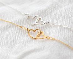 This beautiful interlocking hearts bracelet is available in silver or gold and makes a wonderful gift for Mother & Daughter or best friend.D E T A I L S - available in 925 sterling silver or 24k gold plated- eco-friendly jewelry box with foiled pressed NJ Studio logo- no receipt included - gift-giving ready!- nickel freeS I Z E∙ bracelet is adjustable from 6.7 in to 8.3 in∙ chain length 6.7 in (17 cm) + 1.6 in (4 cm) adjustable chain = maximum length 8.3 in (21 cm)P E R S O N A L I S A T I O Mum Jewellery, Expecting Mother Gifts, New Mommy Gifts, Daughter Bracelet, Hearts Bracelet, Mother Daughter Bracelets, Sister Bracelet, Interlocking Hearts, Sister Jewelry