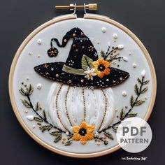 the embroidery pattern has been made to look like a witch's hat with sunflowers on it