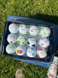 golf balls in a box on the grass