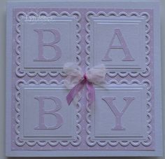 a pink and white greeting card with a bow on the front that says, baby