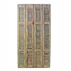 an old wooden door with shutters on it