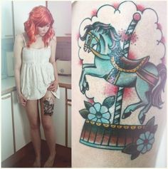 a woman with red hair standing next to a tattoo on her arm and the image of a carousel horse