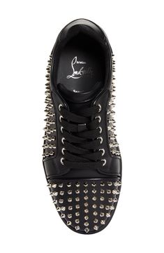 Gleaming metallic cone studs spike the upper of a leather low-top sneaker brightened up with a red logo-debossed tread. Lace-up style Wipe with a soft, dry cloth and store in a dust bag Leather upper/leather and textile lining/synthetic sole Made in Italy Streetwear Lace-up Sneakers With Rhinestone Rivets, Low-top Sneakers With Rhinestone Rivets For Streetwear, Black Studded Low-top Sneakers, Punk Low-top Sneakers With Spikes, Designer Studded Low-top Sneakers, Luxury Studded Lace-up Sneakers, Studded Low-top Sneakers For Streetwear, Low-top Studded Sneakers For Streetwear, Designer Lace-up Sneakers With Spikes