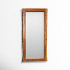 a wooden mirror hanging on the wall