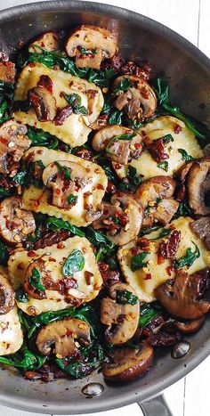 a close up view of mushrooms and spinach