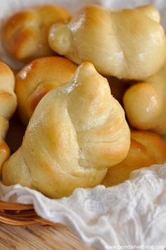 some bread rolls in a basket on a table