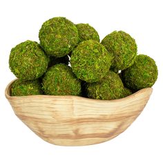 a wooden bowl filled with green moss balls