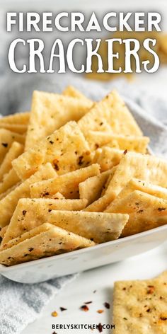 a white bowl filled with crackers on top of a table