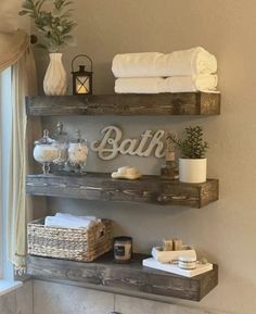 bathroom shelves with towels and candles on them