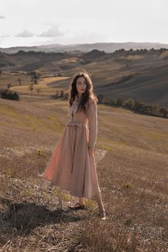 Watching chilly sunrises over the hills covered in the milky fog... and spend slow mornings on the cosy cottage porch, with a cup of hot coffee in hand and a woolen blanket draped over your shoulders sounds like the best idea to start every autumn days? For us too. While dreaming about the gentle sun rays and walks in the mist I created an elegant and feminine Emma dress. A romantic, mid-length, beautiful drape dress that sways gently with each of your autumn steps. The dress is made of delicate Beige A-line Vintage Dress For Spring, Spring Beige A-line Linen Dress, Beige A-line Linen Dress For Spring, Elegant A-line Linen Dress For Garden Party, Feminine A-line Maxi Dress For Fall, Linen Midi Maxi Dress For Garden Party, Linen Maxi Dress For Garden Party, Beige Cotton Prairie Dress For Summer, Fitted Linen Cottagecore Dress For Spring