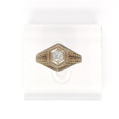 This is part of Chairish’s Fine Jewelry assortment.  A very fine antique engraved 14k gold and diamond ring.  With a lovely ca. 0.24 ct. Old European cut diamond (Color: G /Clarity: I1) set at the center of a hexagonal setting that is engraved with a feathered design to the band and shoulders.  Accompanied by a GEMLAB (Gemological Appraisal Laboratory) report.   Simply a wonderful ring!  Date: 20th Century  Overall Condition: It is in overall good, as-pictured, used estate condition with some ve Vintage Signet Ring With Diamond Accents, Victorian 14k Gold Diamond Cut Rings, Heirloom Diamond White Brilliant Cut Signet Ring, Heirloom Brilliant Cut Diamond White Signet Ring, Antique Yellow Gold Jewelry With Single Diamond, Antique Signet Ring With Diamond Accents For Formal, Antique Signet Ring With Diamond Accents For Formal Occasions, Vintage Single Cut Diamond Ring For Formal Events, Vintage Single Cut Diamond Ring For Formal Occasions