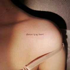 a woman's chest with the words forever is my heart written on it