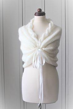 Hello my love, Here I have a very beautiful versatile capelet / scarf you can wear whatever you like it, use your imagination. You can use it as an accessory to your wedding dress, on the way to dinner at night or when attending an outdoor party, ect .. Capelet is made of high quality mohair wool in cream, decorated with a satin ribbon. Looks very elegant and is wonderfully soft. It is very pleasant to wear: Available in the following sizes: 34/36/38/40/42 Custom-made! Matarials used: Mohair85% White One-size Shawl Wrap, One Size White Wrap, White One Size Wrap, White One-size Wrap, White Winter Shawl As Gift, White Winter Shawl Gift, White Shawl Wrap, White Winter Shawl Perfect As A Gift, Hello My Love