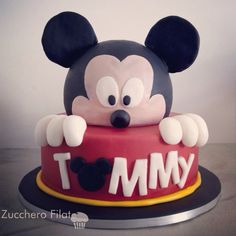 a mickey mouse cake with the word i am my on it's face and ears