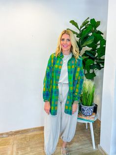 When the vacation vibes are calling, the Vacation Booked Button Down is the answer! With its playful blue and green hues, this lightweight shacket is your go-to for layering over anything from a chic jumpsuit to your favorite jeans. Perfect for breezy fall days, it’s an effortless addition to your wardrobe that’s as versatile as it is stylish. Wear it for a stroll through a fall farmers market or to cozy up at a weekend bonfire, and let this button-down become your ultimate travel companion. PRO Green Spring Outerwear For Vacation, Green Outerwear For Vacation In Spring, Green Outerwear For Spring Vacation, Green Long Sleeve Outerwear For Vacation, Casual Long Sleeve Shacket For Day Out, Trendy Green Summer Outerwear, Green Summer Outerwear With Pockets, Green Summer Outerwear For Vacation, Casual Green Button-up Shacket