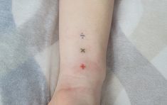 a person with a small tattoo on their arm