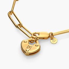 Size Guide  Safety PolicyCare InstructionsA heart of gold worn on your wrist. Our Heart Charm Lock Bracelet is an easy favorite because of its alluring appeal and engravable charm.Gold Vermeil: Gold vermeil provides that lux look you love at a great price. This piece has a thick layer of 18K gold (up to 5 times more than regular plating) over 925 sterling silver.Customize Me! Personalize your heart charm with up to 3 engravings.How To Make It Yours: Let your name shine by engraving your initials Lock Bracelet, Engraved Bracelet, Design Jewelry, Heart Jewelry, Heart Of Gold, Heart Charm, Gold Vermeil, Your Name, Elegant Design