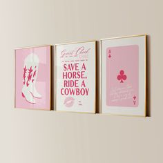 three pink and white posters hanging on the wall