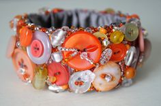 a close up of a bracelet with buttons on it