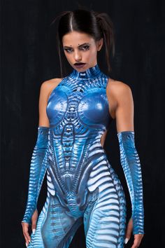 Alien queen but make it sporty. The sleeveless design features a body con fit, a mock neckline, an open back situation and gloves to match. Features: Mock Neckline Low Open Back Matching Gloves Included Robust&Hidden Back Zipper Closure UV Black Light Reactive Non-Transparent Lycra 82% Polyester 18% Elastane 30° Cold Wash, Hang dry Halloween Catsuit, Alien Queen, Uv Black Light, Unique Costumes, Mock Neckline, Halloween Women, Halloween Costumes Women, Catsuit, Black Light