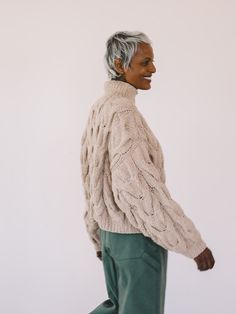 Relaxed, chunky, cropped sweater with mock turtleneck and dropped shoulders. Hand knit in a large Chevron pattern. Made in Peru. Preetha is 5'8” and wears a S/M. Chest: 35," Waist: 31." S/M, L/XL. Relaxed fit. 100% Organic Cotton. Dry Clean Only. Chunky Cropped Sweater, Cotton Turtleneck, Hand Knit Sweater, Camel Sweaters, Hand Knitted Sweaters, Mock Turtleneck, Knitwear Tops, Chevron Pattern, Sweatshirt Dress