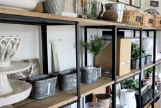 the shelves are filled with pots and containers