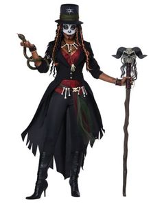 a woman dressed up as a skeleton with a hat and long black hair holding a cane