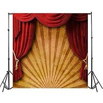 an image of a stage with red curtains