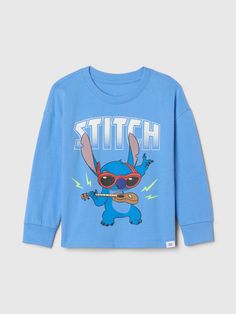 Soft cotton graphic T-shirt.  Crewneck.  Long sleeves.  Disney's Stitch graphics at front.  Straight, easy fit.  Hits at the hip.  Sizes range from baby to toddler. Disney Stitch, Stitch Disney, Baby Disney, Baby Gap, Lilo And Stitch, Baby Toddler, Graphic T Shirt, Gap