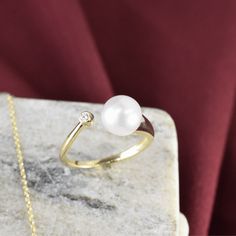 Introducing our 14K Cultured Pearl Bypass Ring – an elegant fusion of timeless charm and exceptional craftsmanship. Gold Pearl Ring With Polished Finish For Anniversary, Refined Open Ring Jewelry For Wedding, Timeless Classic Jewelry For Anniversary, Fine Jewelry With Classic Design As A Gift, Refined Open Ring Jewelry As Gift, Fine Jewelry With Classic Design For Gift, Fine Jewelry Gift With Classic Design, Fine Jewelry For Wedding With Timeless Design, Oval Ring With Timeless Design For Anniversary