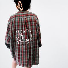 Want some details on what you'd be getting??  Introducing our personalized custom Mrs. Heart Flannel, exclusively designed for your big day or bachelorette party by Beyond Vintage Co! Made with love and attention to detail, this flannel is the perfect addition to your pre-wedding festivities. Embrace the cozy-chic vibe and make a statement with this unique and stylish piece. Our flannels are crafted from high-quality, soft flannel fabric to ensure ultimate comfort. The classic button-down style features long sleeves and a collared neckline for a timeless look. The customized "Mrs.", adorned with a heart, adds a touch of personalization that celebrates your new chapter. Please let us know if you are not wanting a Mrs. added. Each flannel comes with a mrs unless otherwise told prior to proce Bride Flannel Shirt, Bride Flannel, Wedding Shirt, Vintage Flannel, Personalized Bride, Future Mrs, Wedding Shirts, Bachelorette Shirts, Cozy Chic