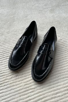 Classic black patent faux leather penny loafers ft. a top stitch around the edge and a flattering narrow fit. Fit True to size. Composition PU This item is final sale Patent Loafers, Black 7, Penny Loafers, New Arrival Dress, Black Patent Leather, The Edge, Classic Black, Patent Leather, Penny