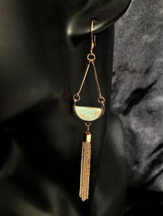 -Handmade Item -Style: Statement -Closure: Gold Ear Wire THESE EARRINGS WILL NOT BE RESTOCKED SO BUY THEM WHILE THEY ARE LISTED!! Fake turquoise, gold tassel dangle earrings. Statement peice! These earrings are lightweight. Packaged nicely in Satin. Long Drop Tassel Chandelier Earrings As A Gift, Long Drop Chandelier Earrings With Tassels For Gifts, Long Drop Chandelier Earrings With Tassels, Unique Dangle Tassel Jewelry, Gift Long Drop Tassel Earrings, Elegant Turquoise Tassel Earrings For Gifts, Brass Tassel Dangle Earrings For Gifts, Tassel Dangle Chandelier Earrings As Gift, Tasseled Drop Earrings As Gift