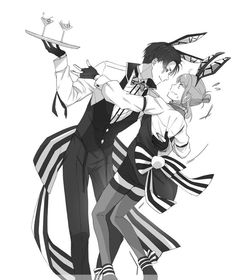 two people dressed in black and white are dancing