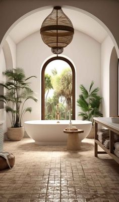 a large bathroom with an arched window and bathtub in the center, surrounded by potted palm trees